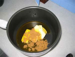Measure the butter then the syrup then the sugar into the saucepan.